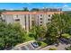 Aerial view of condo building with landscaping at 2630 Pearce Dr # 404, Clearwater, FL 33764