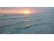 Tranquil ocean waves gently lapping on the shore at sunset at 2630 Pearce Dr # 404, Clearwater, FL 33764