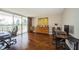 Home office with hardwood floors, two workstations, and large window with balcony view at 2630 Pearce Dr # 404, Clearwater, FL 33764
