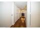 Long hallway with hardwood floors and built-in closets at 2630 Pearce Dr # 404, Clearwater, FL 33764