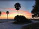 Stunning sunset over the beach with palm trees at 2630 Pearce Dr # 404, Clearwater, FL 33764