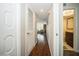 Hallway with wood floors and access to rooms at 2630 Pearce Dr # 404, Clearwater, FL 33764