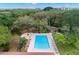 Elevated view of the community pool and surrounding landscape at 2630 Pearce Dr # 404, Clearwater, FL 33764