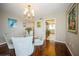 Elegant dining room with glass table and hardwood floor at 2630 Pearce Dr # 404, Clearwater, FL 33764