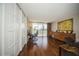 Spacious home office with hardwood floors, built-in shelving, and balcony access at 2630 Pearce Dr # 404, Clearwater, FL 33764