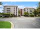 Condo building exterior with landscaping and parking at 2630 Pearce Dr # 404, Clearwater, FL 33764