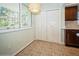 Kitchen with tile floor and white pantry doors at 2630 Pearce Dr # 404, Clearwater, FL 33764