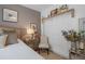 Bedroom with a queen bed, mirrored dresser, and white closet doors at 15722 Aurora Lake Cir, Wimauma, FL 33598