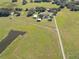 Aerial view showcasing the home's rural setting and surrounding landscape at 4608 Holbrook Rd, Plant City, FL 33565