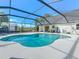 Large, free-form pool with a screened enclosure, perfect for relaxation at 4608 Holbrook Rd, Plant City, FL 33565