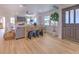 Spacious living room featuring a stone fireplace, hardwood floors, and ample natural light at 4608 Holbrook Rd, Plant City, FL 33565