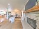 Open concept living area showcasing a stone fireplace and hardwood floors at 4608 Holbrook Rd, Plant City, FL 33565