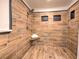Walk-in shower with wood-look tile and built-in seat at 4608 Holbrook Rd, Plant City, FL 33565