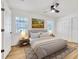 Spacious bedroom with a queen-size bed, wood floors, and ample closet space at 4608 Holbrook Rd, Plant City, FL 33565