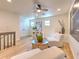 Bright bonus room with wood floors and seating area at 4608 Holbrook Rd, Plant City, FL 33565