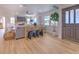 Spacious living room featuring a stone fireplace, hardwood floors, and ample natural light at 4608 Holbrook Rd, Plant City, FL 33565