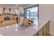 Modern kitchen features white cabinets, quartz countertops, and stainless steel appliances at 4608 Holbrook Rd, Plant City, FL 33565