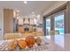 Modern kitchen with white cabinets, quartz countertops and access to the backyard pool at 4608 Holbrook Rd, Plant City, FL 33565