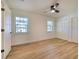Bright bedroom with wood floors and two windows at 4608 Holbrook Rd, Plant City, FL 33565