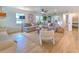 Spacious living room with hardwood floors, comfortable seating and a view to the kitchen at 4608 Holbrook Rd, Plant City, FL 33565