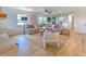 Spacious living room with hardwood floors, comfortable seating and a view to the kitchen at 4608 Holbrook Rd, Plant City, FL 33565
