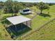 Aerial view of property showing house, carport, and expansive land at 4608 Holbrook Rd, Plant City, FL 33565