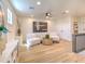 Bright bonus room with wood floors and seating area at 4608 Holbrook Rd, Plant City, FL 33565