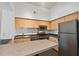 Modern kitchen with stainless steel appliances and light wood cabinets at 2331 W Horatio St # 610, Tampa, FL 33609
