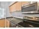 Modern kitchen with stainless steel appliances and dark countertop at 2331 W Horatio St # 610, Tampa, FL 33609