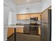 Modern kitchen with dark appliances and wood cabinets at 2331 W Horatio St # 610, Tampa, FL 33609