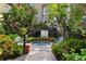 Relaxing hot tub surrounded by lush tropical landscaping and benches at 2331 W Horatio St # 610, Tampa, FL 33609