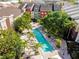 Arial view of a community pool with surrounding lounge chairs and palm trees at 2331 W Horatio St # 610, Tampa, FL 33609