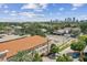 Building complex with parking and cityscape in the background at 2331 W Horatio St # 610, Tampa, FL 33609