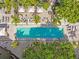 Aerial view of a rectangular pool with surrounding lounge chairs and palm trees at 2331 W Horatio St # 610, Tampa, FL 33609