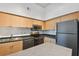 Modern kitchen with stainless steel appliances and light cabinets at 2331 W Horatio St # 610, Tampa, FL 33609