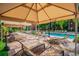 Relaxing pool area with lounge chairs and umbrellas at 2331 W Horatio St # 610, Tampa, FL 33609