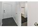 Entryway with dark tile floor, white walls, and access to bathroom at 2331 W Horatio St # 610, Tampa, FL 33609