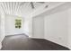 Bright bedroom with dark tile floors and large window at 2331 W Horatio St # 610, Tampa, FL 33609