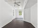 Spacious bedroom with dark gray floors and a large window at 2331 W Horatio St # 610, Tampa, FL 33609