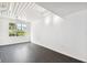 Spacious living area with dark hardwood floors and large window at 2331 W Horatio St # 610, Tampa, FL 33609