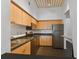 Modern kitchen with stainless steel appliances and light wood cabinets at 2331 W Horatio St # 610, Tampa, FL 33609