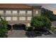 Three-story building with arched entryway and landscaping at 2331 W Horatio St # 610, Tampa, FL 33609