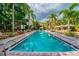 Inviting resort-style pool with ample lounge chairs and lush landscaping at 2331 W Horatio St # 610, Tampa, FL 33609