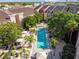Community pool with lounge chairs and patio umbrellas at 2331 W Horatio St # 610, Tampa, FL 33609