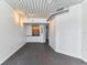 Open living room with dark tile floors and high ceilings at 2331 W Horatio St # 610, Tampa, FL 33609