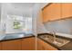 Kitchen with double sink and view into living room at 2331 W Horatio St # 610, Tampa, FL 33609