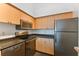 Modern kitchen with stainless steel appliances and wood cabinets at 2331 W Horatio St # 610, Tampa, FL 33609