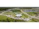 An aerial view of the community pool, playground, and pond at 10744 Hawks Landing Dr, Land O Lakes, FL 34638