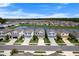 Community aerial view showcasing orderly homes with water views, landscaped yards, and tranquil atmosphere at 10744 Hawks Landing Dr, Land O Lakes, FL 34638