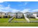 Spacious backyard featuring a white fence enclosing green grass and a patio sitting area at 10744 Hawks Landing Dr, Land O Lakes, FL 34638